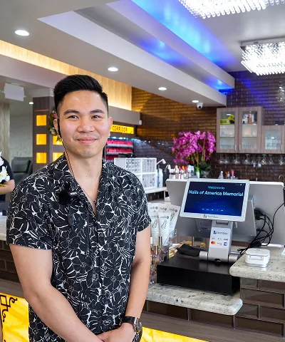 Salon customer using Go Check In tablet at nail salon front desk